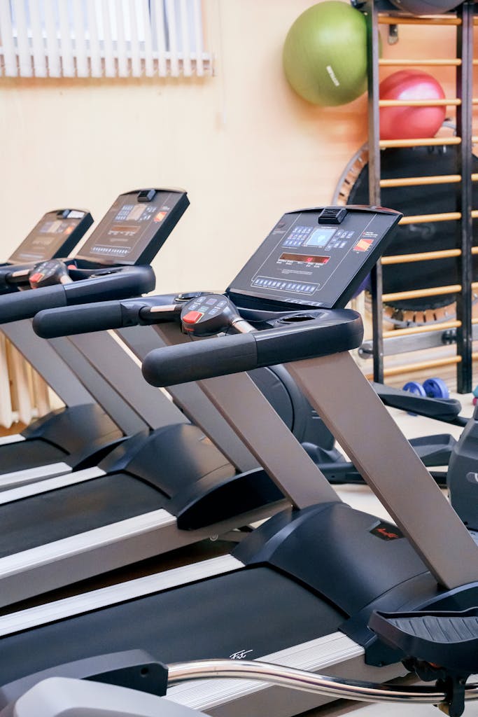 Interior of gym with modern treadmills